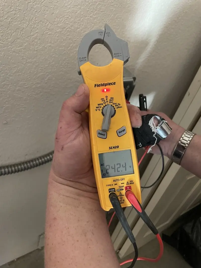 Voltage testing with clamp meter during Hot Tub / Pool Electrical Wiring in Springdale